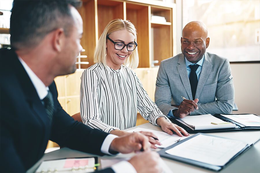 Risk Management - Insurance Advisor Examining Different Risk Options in an Upscale Office Setting